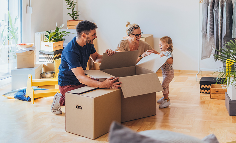 family in front of new home
