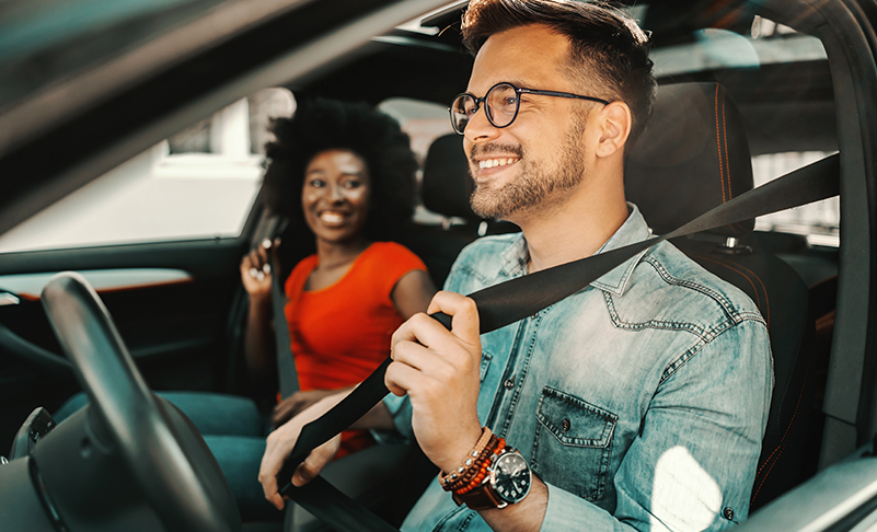 couple smiling in car